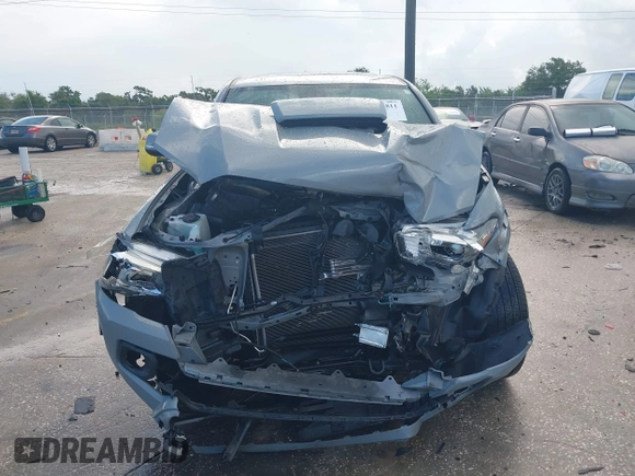 2020 Toyota Tacoma SR5 with VIN 3TMDZ5BN3LM080702, listed as a IAAI auction lot 42463811 with 70,185 mi miles and . Bid and sale history available at DreamBid. Image 12.