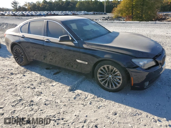 2011 BMW 7 Series 740i with VIN WBAKA4C51BC612629, listed as a Copart auction lot 77372234 with 164,471 mi miles and Salvage Title. Bid and sale history available at carsss.com. Image 4.
