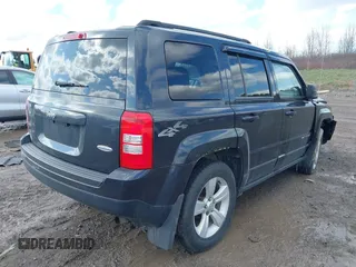 2014 Jeep Patriot Latitude with VIN 1C4NJRFB9ED778409, listed as a IAAI auction lot 41952027 with 88,306 mi miles and . Bid and sale history available at DreamBid. Image 4.