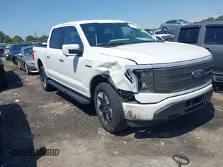 2022 Ford F-150 Lightning Pro z VIN 1FTVW1EL3NWG16227, wystawiony jako IAAI lot #41994584 z przebiegiem 23 341 mil mil oraz . Historia ofert i sprzedaży dostępna na DreamBid. Obrazek 1.