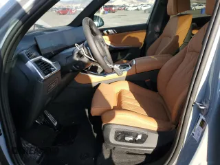 2025 BMW X5 sDrive40i with VIN 5UX13EU09S9X71671, listed as a Copart auction lot 42515055 with 2,695 mi miles and Salvage Title. Bid and sale history available at carsss.com. Image 7.