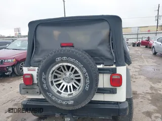 2005 Jeep Wrangler Sport with VIN 1J4FA49S25P320240, listed as a IAAI auction lot 41433371 with 144,552 mi miles. Bid and sale history available at carsss.com. Image 16.