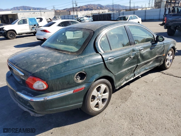 2002 Jaguar X-Type with VIN SAJEA51C12WC33477, listed as a Copart auction lot 83711124 with 165,637 mi miles and Salvage Title. Bid and sale history available at carsss.com. Image 3.