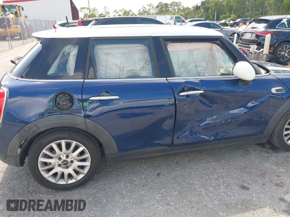2015 MINI Hardtop 4 Door with VIN WMWXS5C51FT827510, listed as a IAAI auction lot 42365599 with 53,667 mi miles and . Bid and sale history available at DreamBid. Image 6.