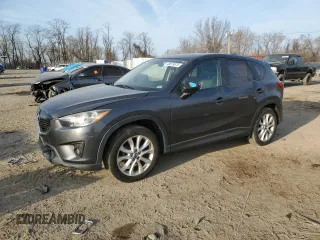 2014 Mazda CX-5 Grand Touring with VIN JM3KE4DY5E0372787, listed as a Copart auction lot 48873675 with 136,784 mi miles and Salvage Title. Bid and sale history available at carsss.com. Image 1.