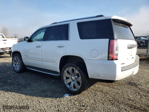 2016 GMC Yukon Denali with VIN 1GKS2CKJ4GR414628, listed as a Copart auction lot 89321675 with 130,591 mi miles and Salvage Title. Bid and sale history available at carsss.com. Image 2.