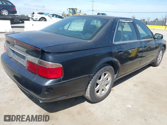 1998 Cadillac Seville STS z VIN 1G6KY5499WU916185, wystawiony jako IAAI lot #42035783 z przebiegiem 164 763 mil mil oraz . Historia ofert i sprzedaży dostępna na DreamBid. Obrazek 4.