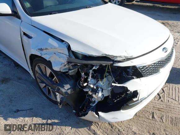 2016 Kia Optima SX Turbo with VIN 5XXGW4L2XGG084628, listed as a IAAI auction lot 41668592 with 116,535 mi miles and . Bid and sale history available at carsss.com. Image 6.