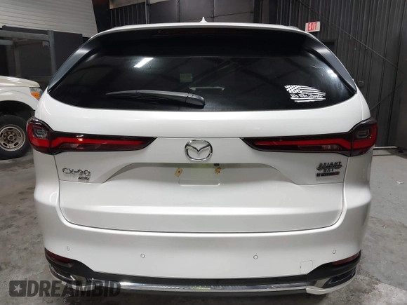 2024 Mazda CX-90 S Premium z VIN JM3KKDHCXR1103272, wystawiony jako IAAI lot #40301969 z przebiegiem 5 235 mil mil oraz . Historia ofert i sprzedaży dostępna na DreamBid. Obrazek 17.