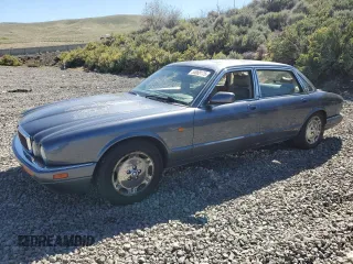 1997 Jaguar XJ with VIN SAJHX6240VC797228, listed as a Copart auction lot 55068175 with 149,644 mi miles and Salvage title. Bid and sale history available at DreamBid. Image 1.