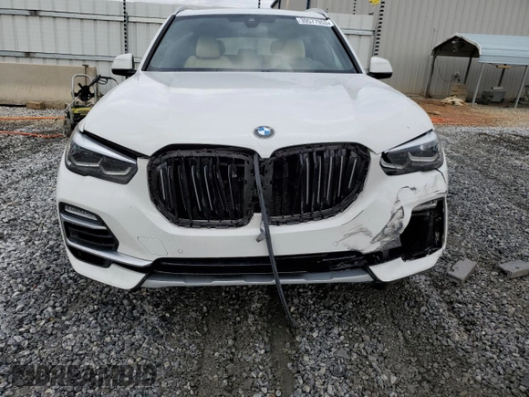 2021 BMW X5 sDrive40i with VIN 5UXCR4C04M9E30879, listed as a Copart auction lot 39577953 with 19,276 mi miles. Bid and sale history available at carsss.com. Image 5.