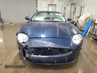 2007 Jaguar XK with VIN SAJDA44BX75B00447, listed as a Copart auction lot 50147695 with 119,467 mi miles and Salvage Title. Bid and sale history available at carsss.com. Image 5.