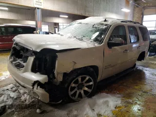 2010 GMC Yukon SLT with VIN 1GKUKCE06AR276478, listed as a Copart auction lot 87904975 with 182,897 mi miles and Salvage Title. Bid and sale history available at carsss.com. Image 1.