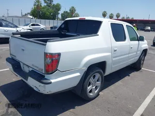 2013 Honda Ridgeline RTL with VIN 5FPYK1F50DB013612, listed as a IAAI auction lot 42430119 with 190,913 mi miles and . Bid and sale history available at DreamBid. Image 4.