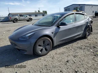 2023 Tesla Model 3 with VIN 5YJ3E1EA3PF669736, listed as a Copart auction lot 54679685 with 14,738 mi miles and Salvage title. Bid and sale history available at DreamBid. Image 1.