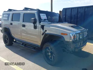 2003 Hummer H2 with VIN 5GRGN23U43H125114, listed as a IAAI auction lot 42160986 with 157,776 mi miles. Bid and sale history available at carsss.com. Image 1.