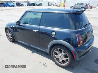 2006 MINI Hardtop S with VIN WMWRE33596TJ35502, listed as a IAAI auction lot 42474204 with 126,938 mi miles and . Bid and sale history available at DreamBid. Image 3.