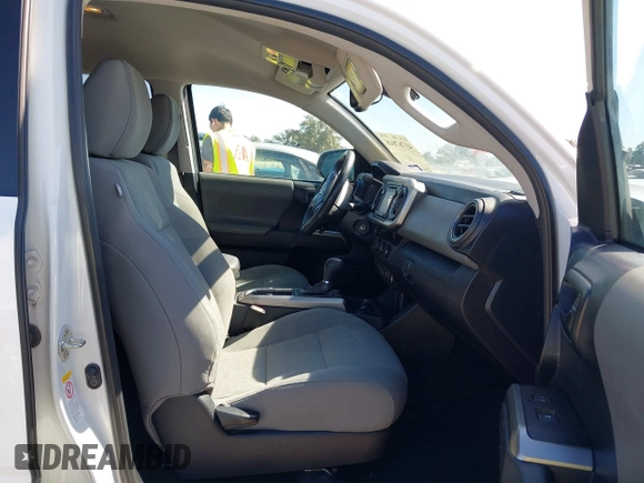 2018 Toyota Tacoma SR5 with VIN 5TFAZ5CN4JX056465, listed as a IAAI auction lot 41767848 with 71,532 mi miles and . Bid and sale history available at DreamBid. Image 5.