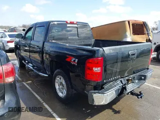 2013 Chevrolet Silverado 1500 LT with VIN 3GCPKSE71DG329253, listed as a IAAI auction lot 41723597 with 164,539 mi miles. Bid and sale history available at carsss.com. Image 3.