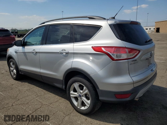 2014 Ford Escape SE with VIN 1FMCU9GX3EUB19987, listed as a Copart auction lot 64042695 with 96,775 mi miles and Salvage title. Bid and sale history available at DreamBid. Image 2.