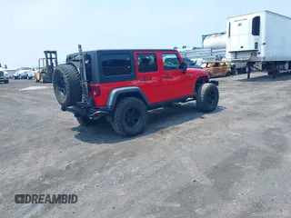 2014 Jeep Wrangler Unlimited Rubicon with VIN 1C4BJWFG0EL326979, listed as a IAAI auction lot 41913129 with 118,548 mi miles and . Bid and sale history available at DreamBid. Image 4.