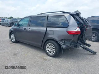 2015 Toyota Sienna XLE with VIN 5TDYK3DCXFS688971, listed as a IAAI auction lot 42127912 with 143,024 mi miles. Bid and sale history available at carsss.com. Image 3.