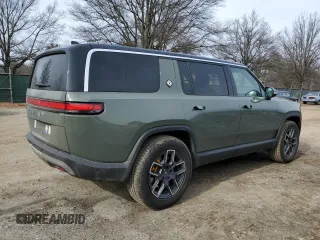 2022 Rivian R1S Launch Edition z VIN 7PDSGABL4NN000393, wystawiony jako Copart lot #44218005 z przebiegiem 26 598 mil mil oraz Szkoda całkowita • Salvage title. Historia ofert i sprzedaży dostępna na DreamBid. Obrazek 3.