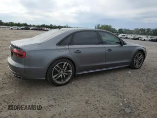 2017 Audi A8 z VIN WAU44AFD1HN009176, wystawiony jako Copart lot #57647675 z przebiegiem 94 317 mil mil oraz Szkoda całkowita • Salvage title. Historia ofert i sprzedaży dostępna na DreamBid. Obrazek 3.