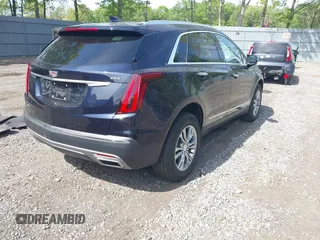 2021 Cadillac XT5 AWD Premium Luxury z VIN 1GYKNDRS8MZ217572, wystawiony jako IAAI lot #42190571 z przebiegiem 25 100 mil mil oraz . Historia ofert i sprzedaży dostępna na DreamBid. Obrazek 4.