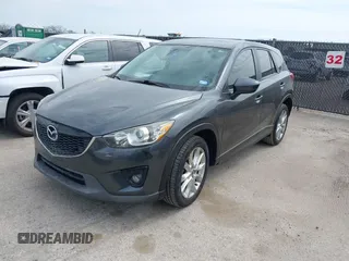 2014 Mazda CX-5 Grand Touring with VIN JM3KE2DY0E0354220, listed as a IAAI auction lot 41885502 with 168,901 mi miles. Bid and sale history available at carsss.com. Image 2.
