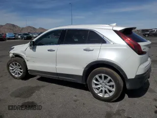 2023 Cadillac XT4 FWD Luxury with VIN 1GYAZAR46PF134602, listed as a Copart auction lot 54684865 with 13,221 mi miles and Salvage title. Bid and sale history available at DreamBid. Image 2.