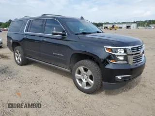 2015 Chevrolet Suburban LTZ with VIN 1GNSKKKC1FR624679, listed as a Copart auction lot 52957365 with 71,194 mi miles and Salvage Title. Bid and sale history available at DreamBid. Image 4.