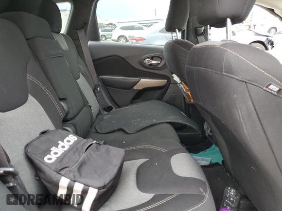 2017 Jeep Cherokee Altitude with VIN 1C4PJLAB2HW573567, listed as a Copart auction lot 59630205 with 105,975 mi miles and Salvage title. Bid and sale history available at DreamBid. Image 11.
