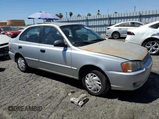 2002 Hyundai Accent GL with VIN KMHCG45C92U353198, listed as a Copart auction lot 68305654 with 130,594 mi miles and Clean Title. Bid and sale history available at carsss.com. Image 4.