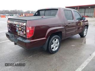 2009 Honda Ridgeline RTL with VIN 5FPYK16529B100032, listed as a IAAI auction lot 41206781 with 130,694 mi miles and . Bid and sale history available at DreamBid. Image 4.