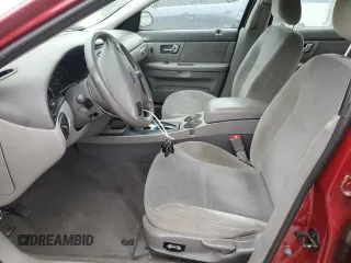 2002 Ford Taurus SE Standard z VIN 1FAFP53U22A220891, wystawiony jako Copart lot #55665405 z przebiegiem 131 530 mil mil oraz Szkoda całkowita • Salvage title. Historia ofert i sprzedaży dostępna na DreamBid. Obrazek 7.