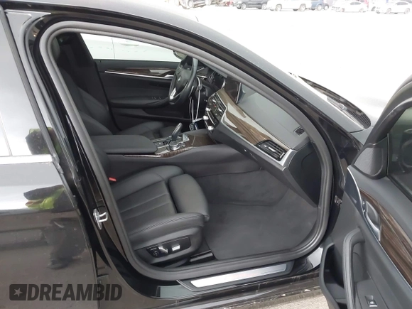 2019 BMW 5 Series 530i with VIN WBAJA5C58KWW11641, listed as a IAAI auction lot 41946359 with 48,635 mi miles and . Bid and sale history available at DreamBid. Image 5.