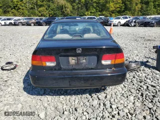 1997 Honda Civic DX with VIN 1HGEJ6228VL123265, listed as a Copart auction lot 74078684 with 49,904 mi miles and Salvage Title. Bid and sale history available at carsss.com. Image 6.
