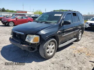2006 GMC Envoy SLE z VIN 1GKDS13S662131093, wystawiony jako Copart lot #51943955 z przebiegiem 229 793 mil mil oraz Szkoda całkowita • Salvage title. Historia ofert i sprzedaży dostępna na DreamBid. Obrazek 1.