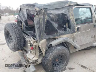2003 Jeep Wrangler X with VIN 1J4FA39SX3P329386, listed as a IAAI auction lot 41407594 with 140,390 mi miles. Bid and sale history available at carsss.com. Image 13.