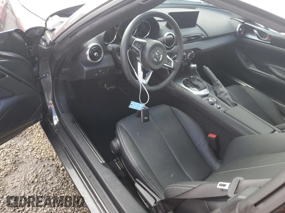 2024 Mazda MX-5 Miata Grand Touring z VIN JM1NDAM73R0603254, wystawiony jako Copart lot #74551704 z przebiegiem Nie podano mil oraz Nie do naprawy • Non repairable. Historia ofert i sprzedaży dostępna na DreamBid. Obrazek 8.