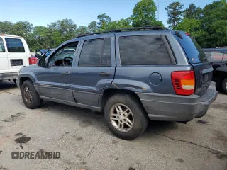 2004 Jeep Grand Cherokee Laredo with VIN 1J4GX48S24C216941, listed as a Copart auction lot 55584785 with 279,710 mi miles and Salvage title. Bid and sale history available at DreamBid. Image 2.