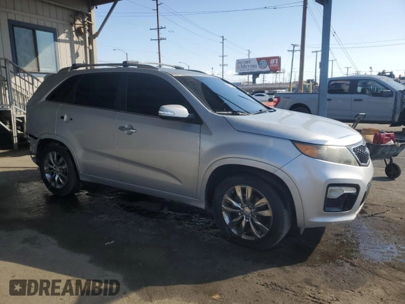 2011 Kia Sorento SX with VIN 5XYKW4A28BG170568, listed as a Copart auction lot 44372555 with 218,737 mi miles and Salvage Title. Bid and sale history available at carsss.com. Image 4.