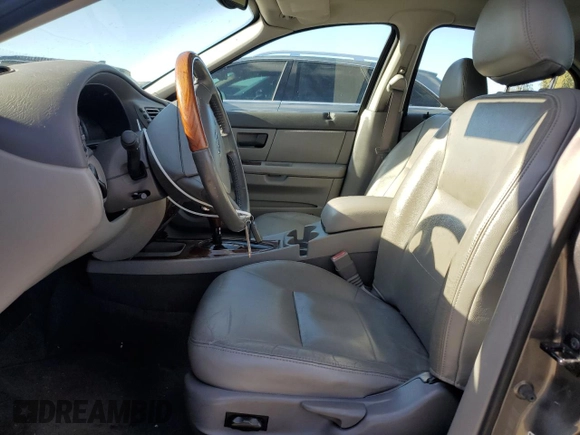 2005 Ford Taurus z VIN 1FAHP59U15A158162, wystawiony jako Copart lot #81109994 z przebiegiem 81 196 mil mil oraz Czysty tytuł • Clean title. Historia ofert i sprzedaży dostępna na DreamBid. Obrazek 7.