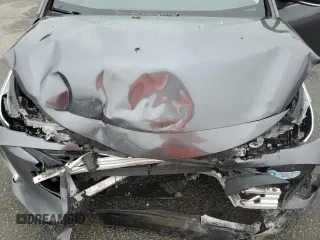 2021 Toyota Prius LE z VIN JTDKAMFP1M3172737, wystawiony jako Copart lot #57056205 z przebiegiem Nie podano mil oraz Szkoda całkowita • Salvage title. Historia ofert i sprzedaży dostępna na DreamBid. Obrazek 11.