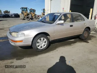1994 Toyota Camry LE z VIN JT2GK12EXR0070117, wystawiony jako Copart lot #75997244 z przebiegiem 185 759 mil mil oraz Czysty tytuł • Clean title. Historia ofert i sprzedaży dostępna na DreamBid. Obrazek 1.