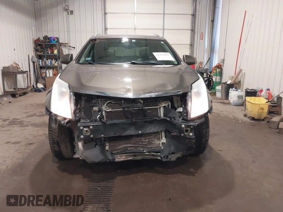 2014 Cadillac SRX Performance Collection z VIN 3GYFNFE38ES578066, wystawiony jako IAAI lot #42153023 z przebiegiem 134 009 mil mil oraz . Historia ofert i sprzedaży dostępna na DreamBid. Obrazek 13.