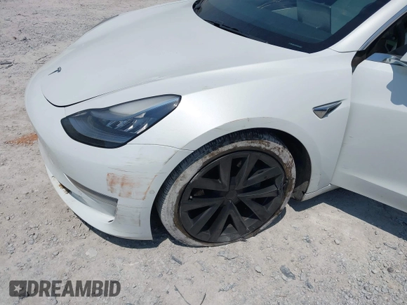2019 Tesla Model 3 Long Range with VIN 5YJ3E1EB4KF494432, listed as a IAAI auction lot 42009327 with 121,954 mi miles and . Bid and sale history available at DreamBid. Image 6.