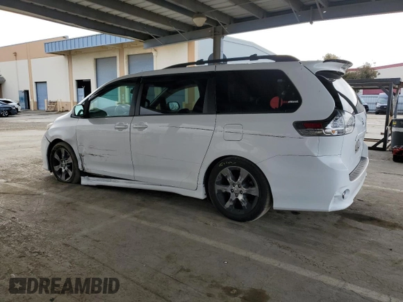 2012 Toyota Sienna SE with VIN 5TDXK3DC9CS215991, listed as a Copart auction lot 51868005 with 215,075 mi miles and Salvage title. Bid and sale history available at DreamBid. Image 2.