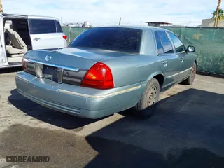 2006 Mercury Grand Marquis GS with VIN 2MEFM74V16X650056, listed as a IAAI auction lot 42107815 with 156,710 mi miles. Bid and sale history available at carsss.com. Image 4.